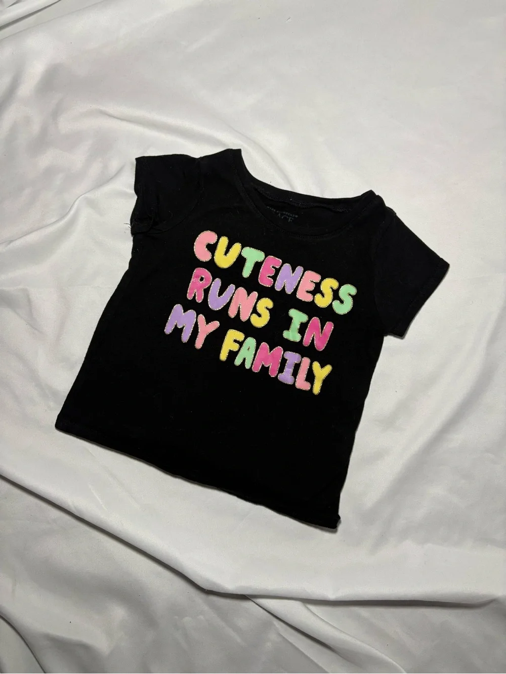 Girls Black Tee with Colorful 'Cuteness Runs In My Family' Graphic
